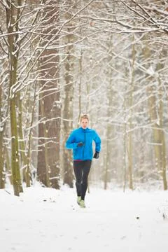 Man running in winter Stock Photos