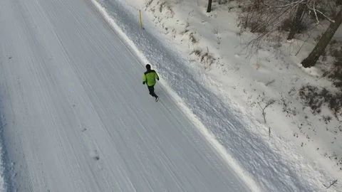 Man running winter scene, 4K aerial Video stock 72952488