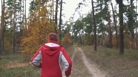 A man is running in the woods Stock Footage 82424529