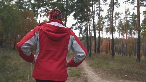 A man is running in the woods Stock Footage 82424560