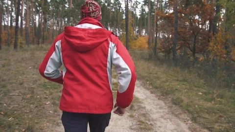 A man is running in the woods Stock Footage 82424649