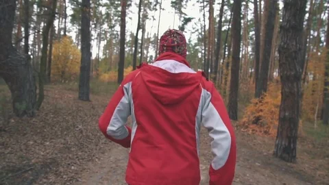 A man is running in the woods Stock Footage 82424664
