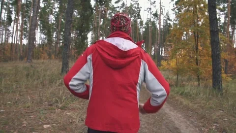 A man is running in the woods Stock Footage 82424687