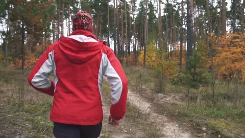 A man is running in the woods Stock Footage 82424734