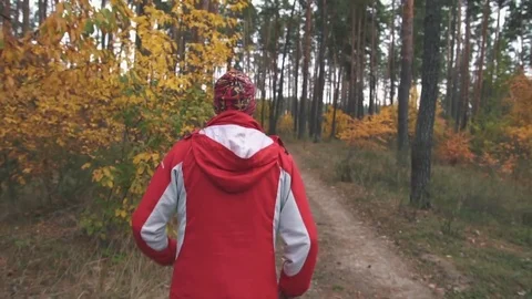 A man is running in the woods Stock Footage 82424746