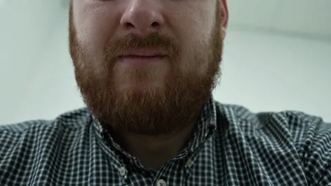 Man with a Runny Nose Using a Nasal Spray as a Treatment sitting in the office. Stock Footage 270522120