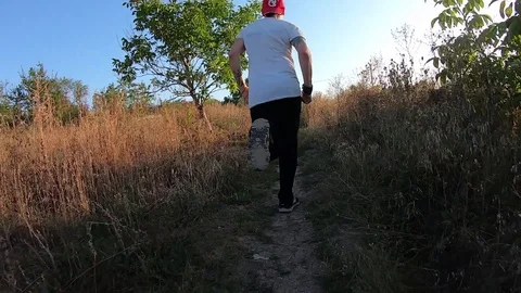 Man runs along the trail Stock Footage