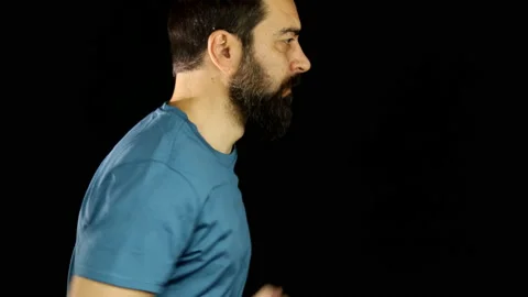 A man runs on a black background. Stock Footage 157601475