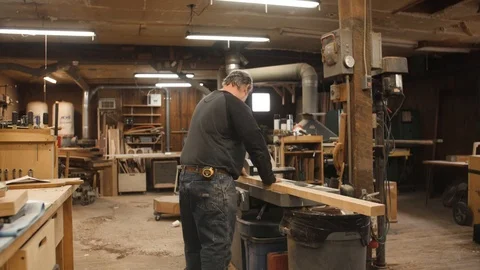 Man runs board through jointer machine Stock-Footage 102044932