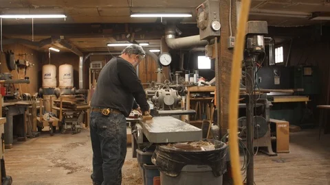 Man runs board through jointer machine Stock-Footage 102044972