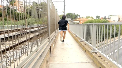 Man Runs On A Bridge Escaping Stock Footage 95581067