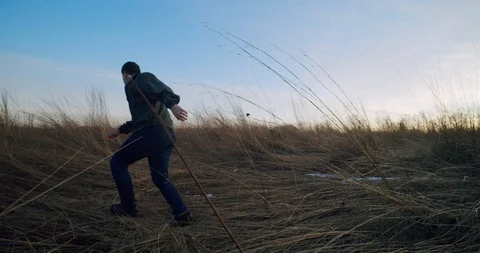 Man Runs Into Frame then Into Distance Stock Footage 122221565
