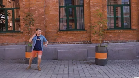 A man runs funny, remembering that he forgot something, is late for a meeting Stock Footage 139014077
