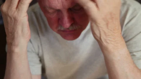 Man runs hands through his hair Stock Footage 88712284