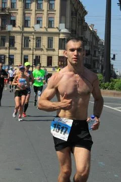 A man runs a marathon Stock Photos