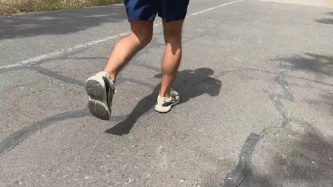 Man runs outdoor pavement path. Energy and active lifestyle concept Vídeo Stock 336596817