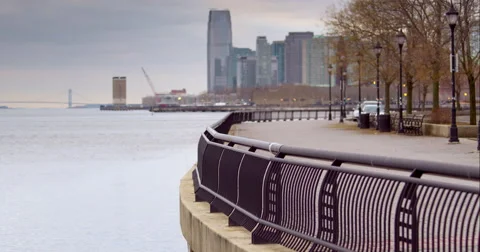 A man runs a park path along the Hudson River in Hoboken Stock Footage 51278641