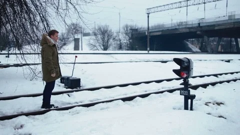 A man runs on rails in winter Stock Footage 82319016