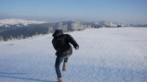 Man runs in snow Video stock 72747553