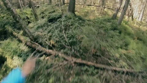 A man runs through the forest with all his might, fleeing from danger. Stock Footage 159496190