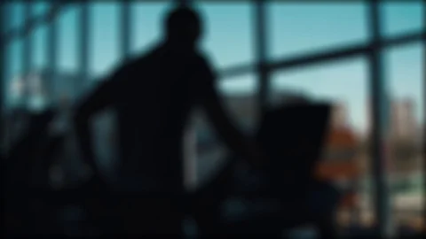 Man runs on a treadmill on a window background Stock Footage 88830087