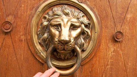 A man s hand opens the door, a close-up photo. The hand holds onto the antique Stock Footage 102719322