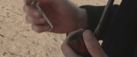 Man 's hand , smoking pipe Video stock 169546670