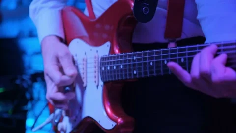 Man s hands playing an electric guitar in the nightclub. Stock Footage 132243609