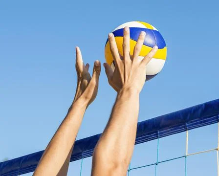 Man s hands preparing hit incoming volleyball net . High quality and resolution Stock Photos