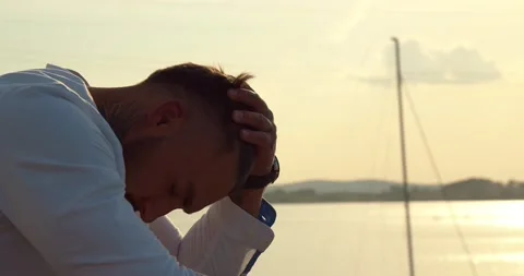 The man is sad by the lake Video stock 156959923