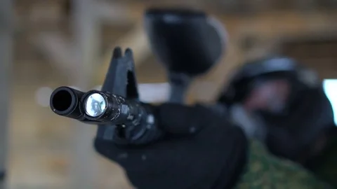 Man in safe glasses shooting with marker Stock Footage 84279705
