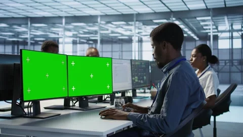 Man safeguarding data center against hackers with isolated screen computer Stock Footage 319557127