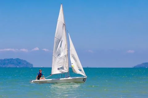 Man sailing. Boy learning to sail on sea yacht. Stock Photos