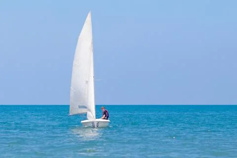 Man sailing. Boy learning to sail on sea yacht. Stock Photos