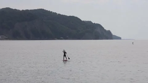 Man sailing on SUP Stock Footage 258078425