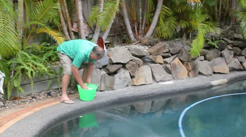 Man Salts Swimming Pool Stock Footage 34406329
