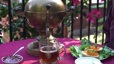Man Samovar Sugar in tea Stock Footage 77360674