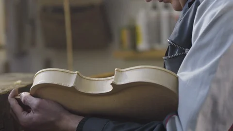 Man is sanding a violin 스톡 동영상 98047319