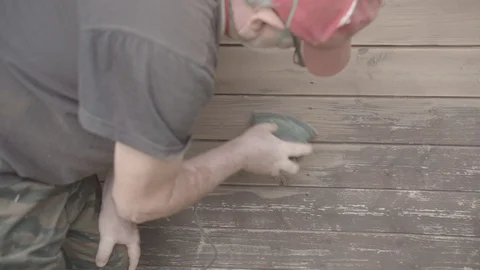 Man Sanding Wooded Wall Using Hand Sander Stock Footage 116556556