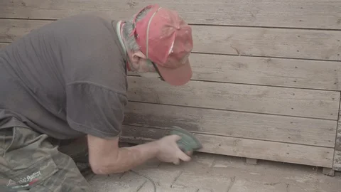 Man Sanding Wooded Wall Using Hand Sander Stock Footage 116556766