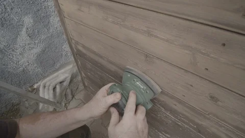 Man Sanding Wooded Wall Using Hand Sander Stock Footage 116558300
