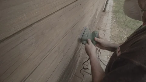 Man Sanding Wooded Wall Using Hand Sander Stock Footage 116560109