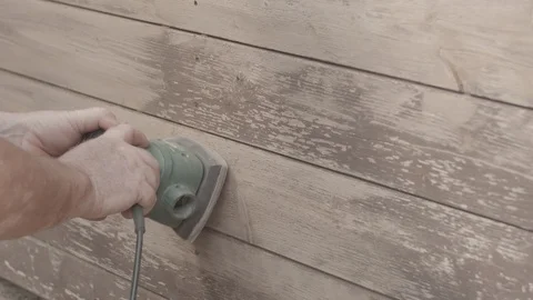 Man Sanding Wooded Wall Using Hand Sander In Slowmotion Stock Footage 116561400
