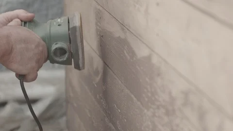 Man Sanding Wooded Wall Using Hand Sander In Slowmotion Stock Footage 116562007