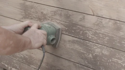Man Sanding Wooded Wall Using Hand Sander In Slowmotion Stock Footage 116562248