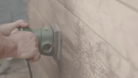 Man Sanding Wooded Wall Using Hand Sander In Slowmotion Stock Footage 116562265