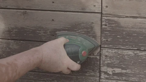 Man Sanding Wooded Wall Using Hand Sander In Slowmotion Stock Footage 116562738
