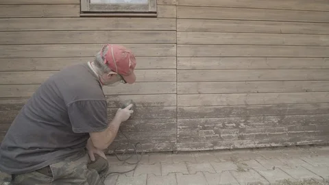 Man Sanding Wooded Wall Using Hand Sander Stock Footage 116564413