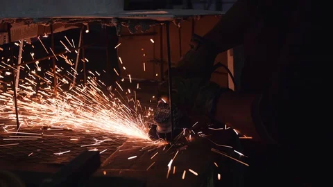 Man sands a piece of metal with the grinder Stock Footage 101538642