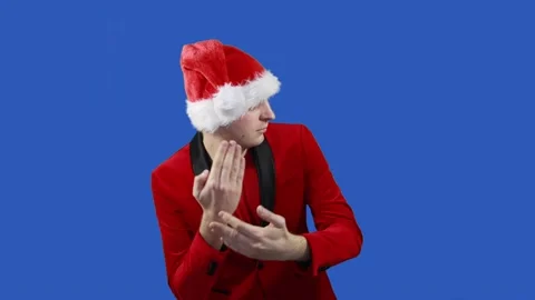 Man like a Santa Claus dances on blue screen background, timelapse. Christmas Video stock 143238901